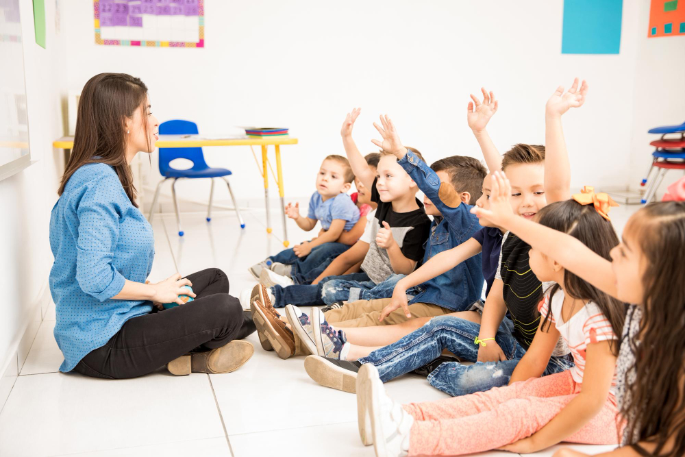 a teacher teaching pre schoolers